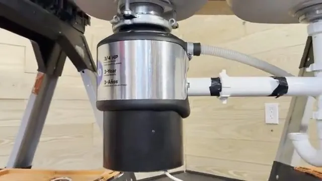 Discharge pipe attached to a garbage disposal unit