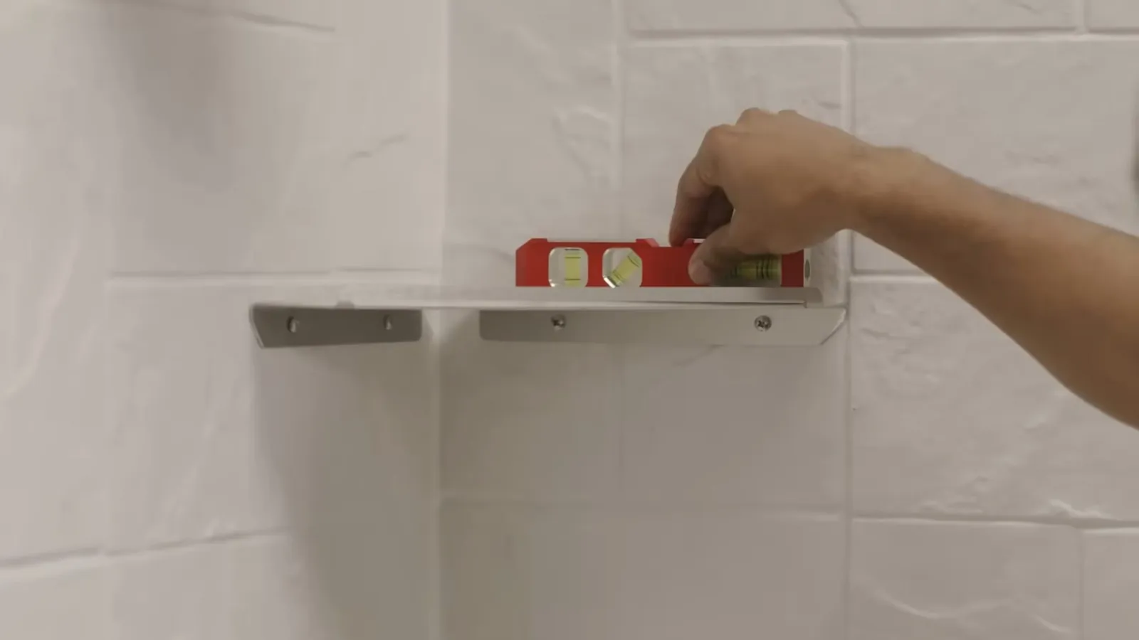 Bathroom fixture leveled against a wall during a remodel