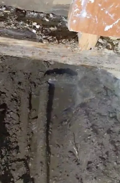 Direct slab leak repair through a small opening in the concrete floor