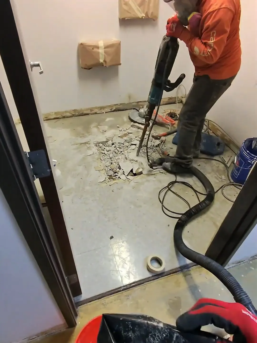 Commercial bathroom floor drain rough-in before finishing