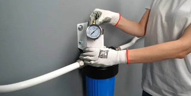 Mineral scale buildup on a showerhead compared side by side with a clean one