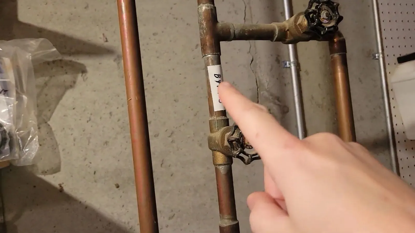 Copper pipes staged and ready for a water heater installation