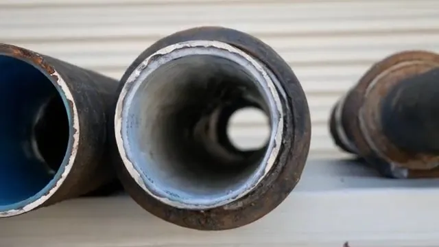 New lined pipe coupled to an old cast-iron drain section