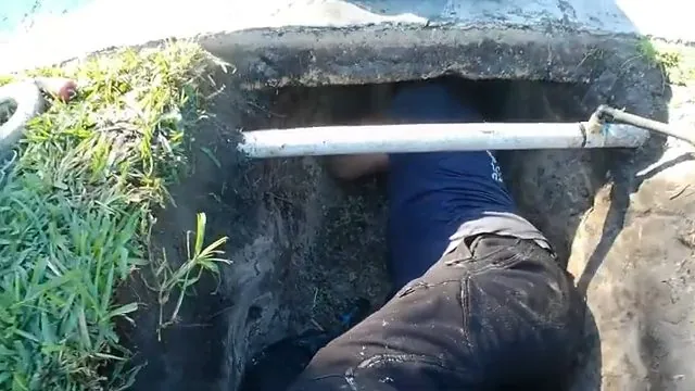 Excavated pool deck with an exposed return pipe