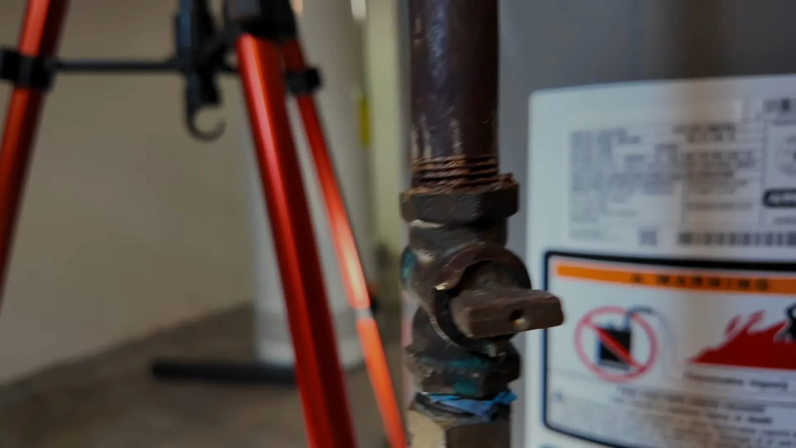 Gas shutoff valve mounted beside a water heater