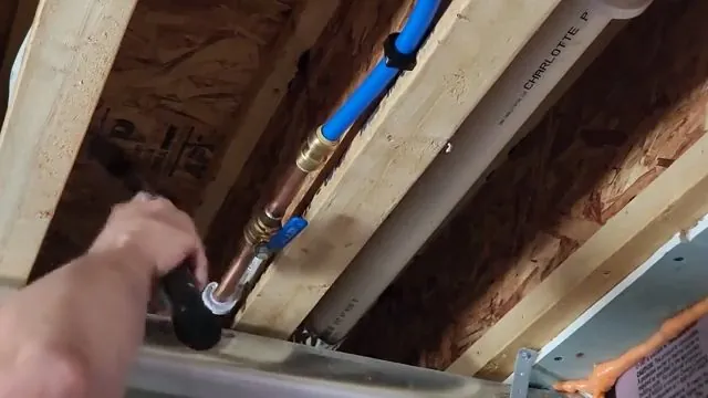 New PEX supply lines installed through wall cavity joists