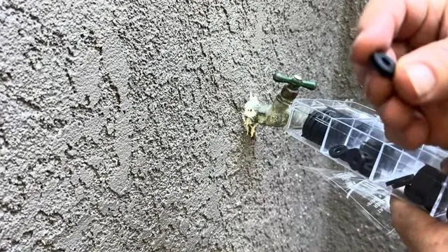 Exterior hose bib leaking against a stucco wall