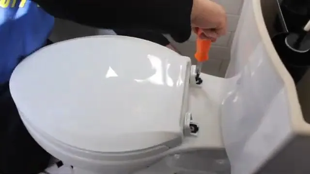 Plumber working beside a toilet during a remodel