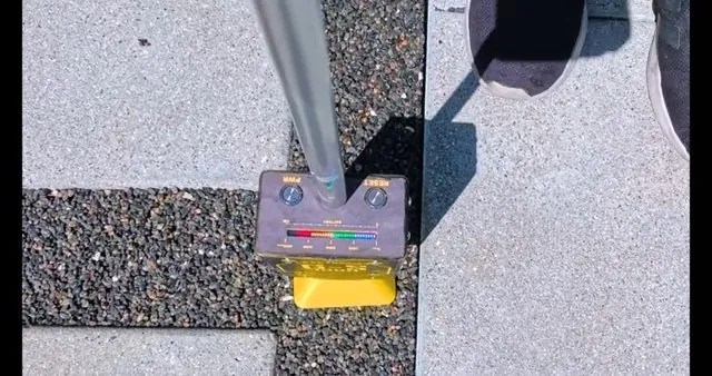 Plumber's tool kit set out on a concrete sidewalk before a job