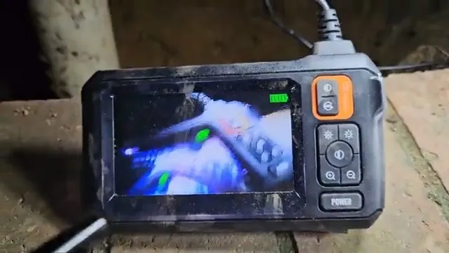 Sewer camera monitor showing a clean pipe interior after jetting