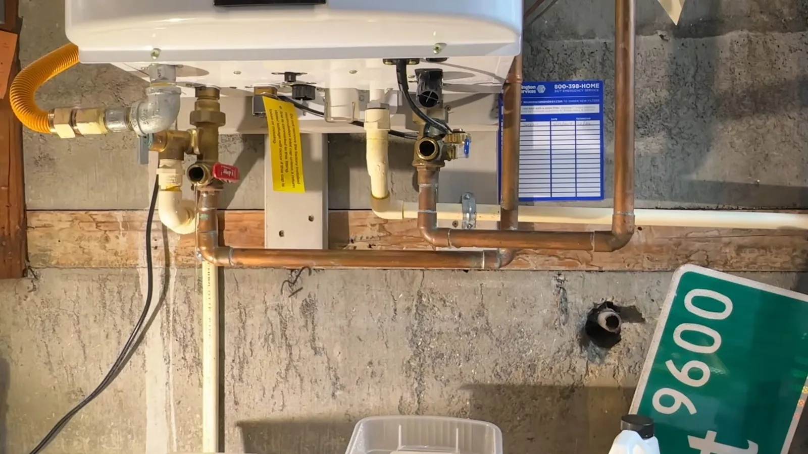 Pipes and valves connected to a point-of-use tankless water heater