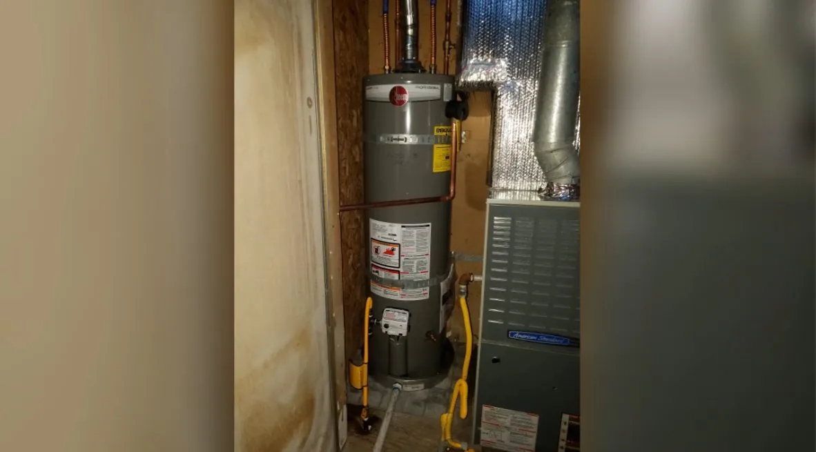 Water heater installed in a cupboard-style utility closet